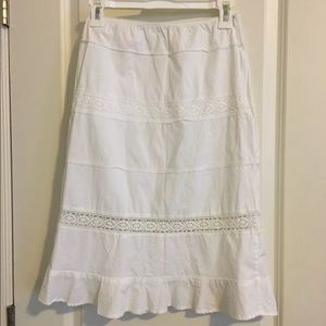 Cute white skirt with lace openings on the bottom